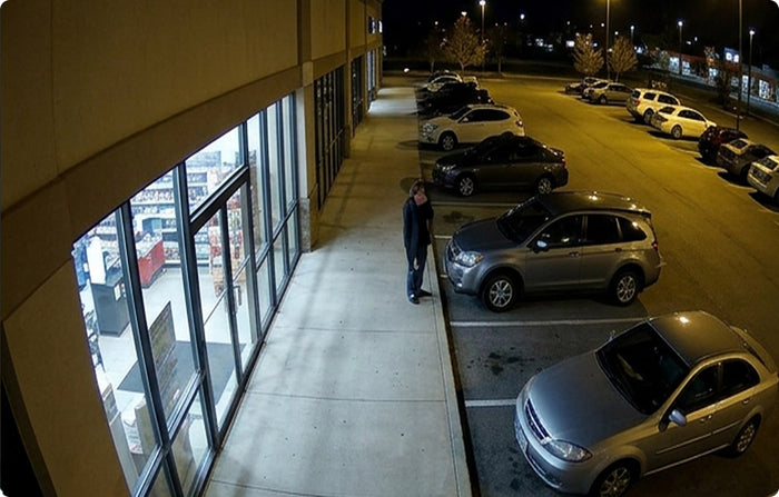 Illuminated commercial parking area viewed at night