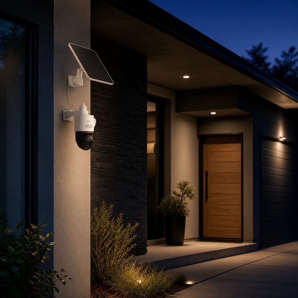 eufyCam S4 and solar panel mounted beside a home entrance at night