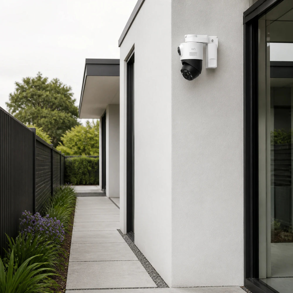 eufyCam S4 mounted on a modern side-yard property corner