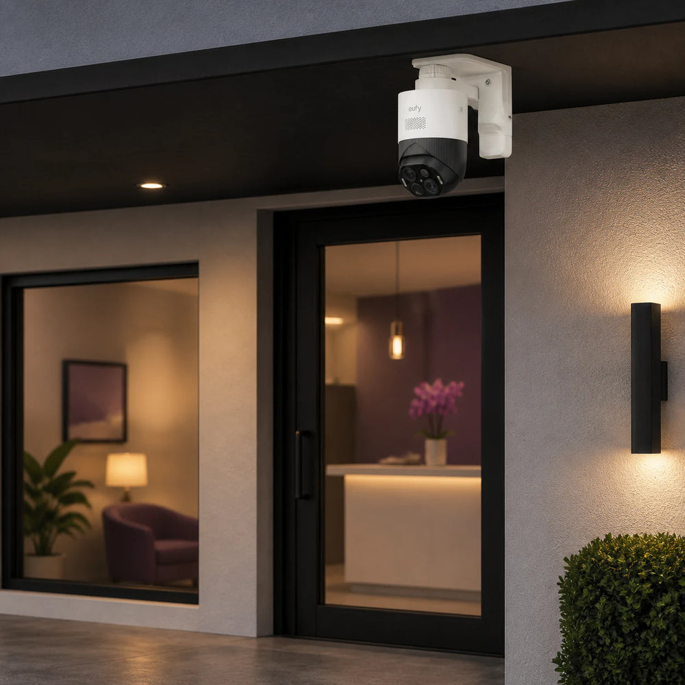 eufyCam S4 mounted beneath a small storefront entrance canopy