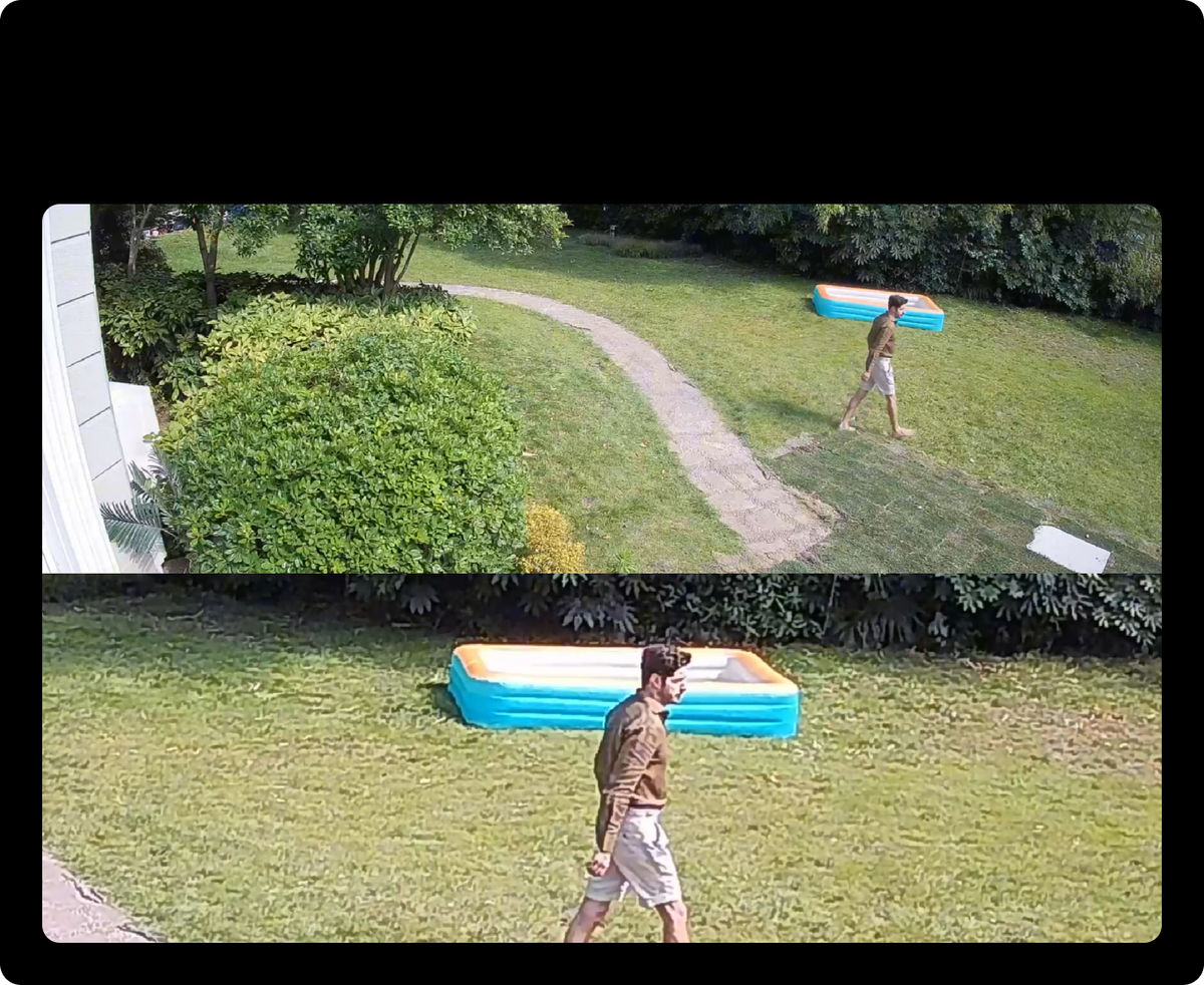 Wide and close camera views of a person walking across a yard