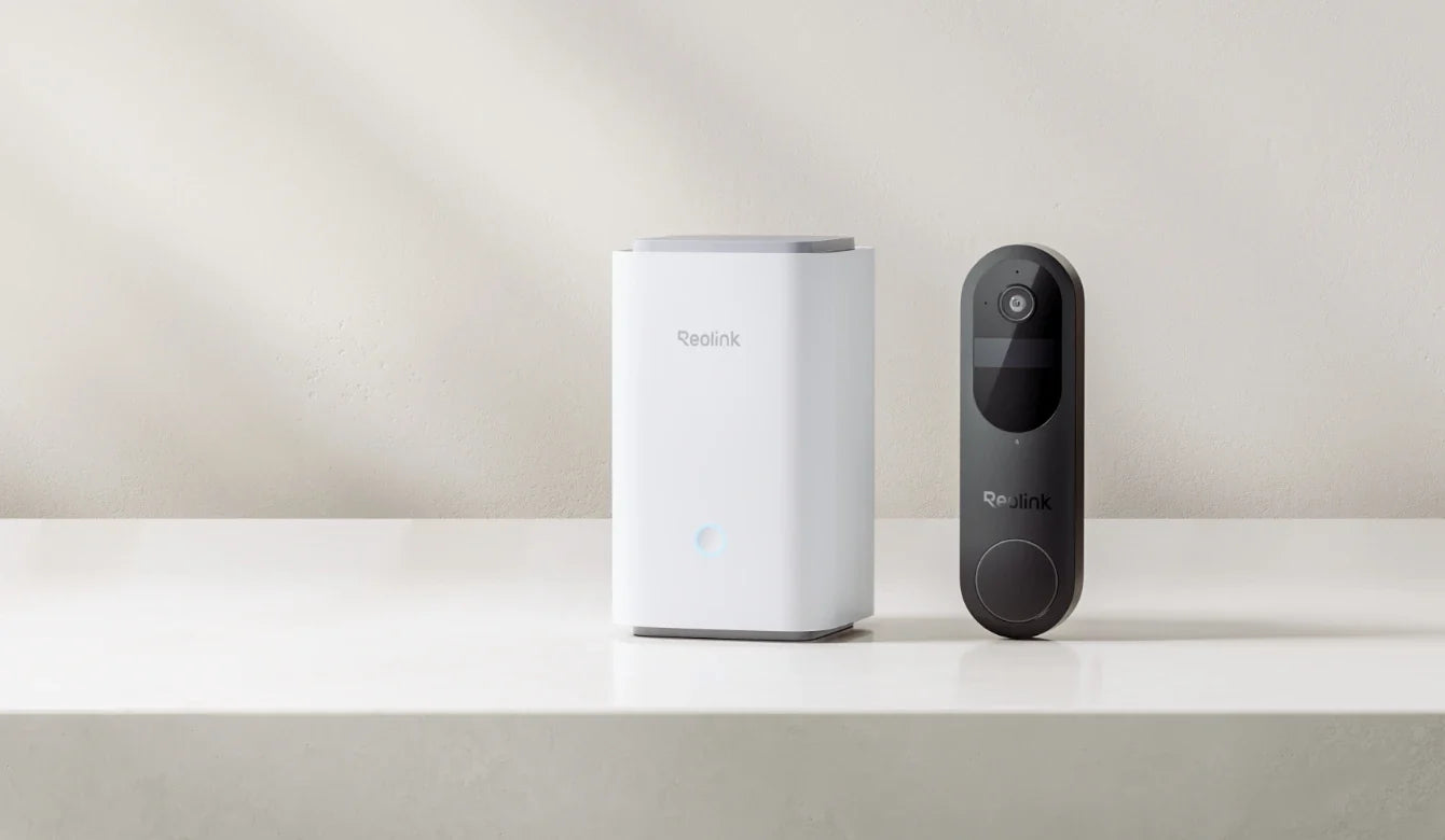 Battery video doorbell installed beside an indoor Reolink Home Hub